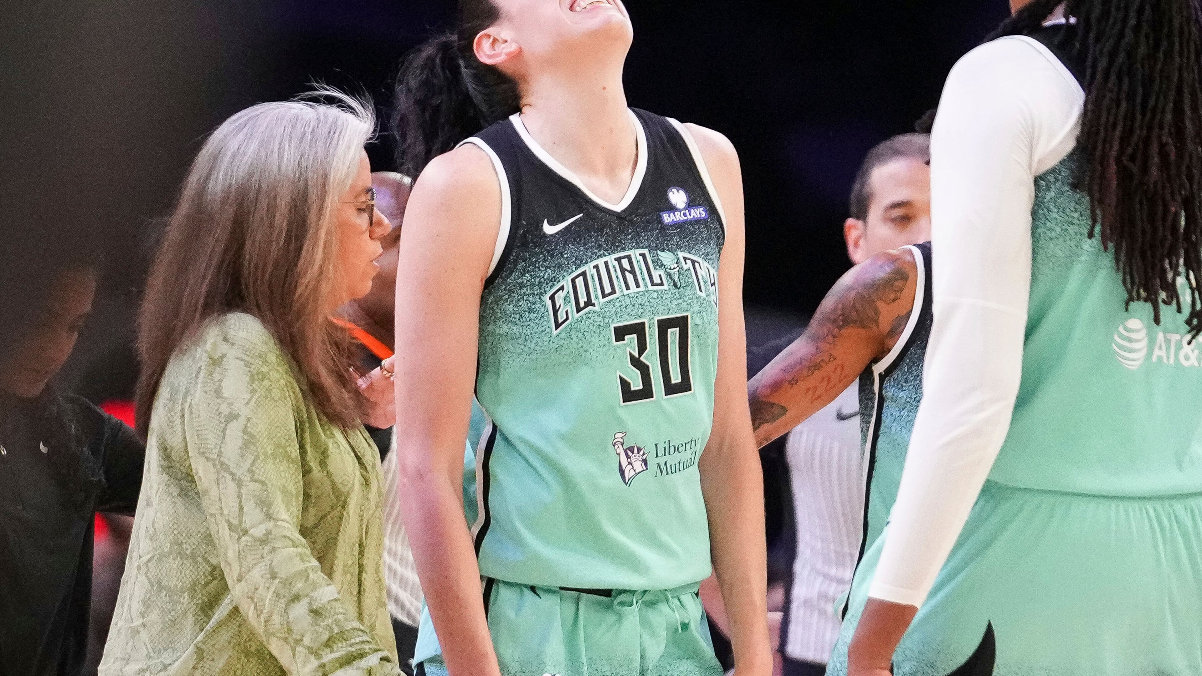 New York Liberty forward Breanna Stewart (30) grimaces after getting fouled by the Phoenix Mercury during the second half of Game 1 during the first round of the WNBA basketball playoffs Sunday, Sept. 14, 2025, in Phoenix. (AP Photo/Darryl Webb)