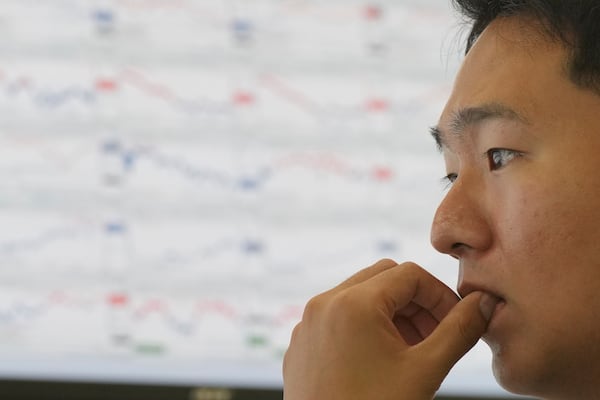 A dealer watches computer monitors at a dealing room of Hana Bank in Seoul, South Korea, Wednesday, June 18, 2025. (AP Photo/Lee Jin-man)