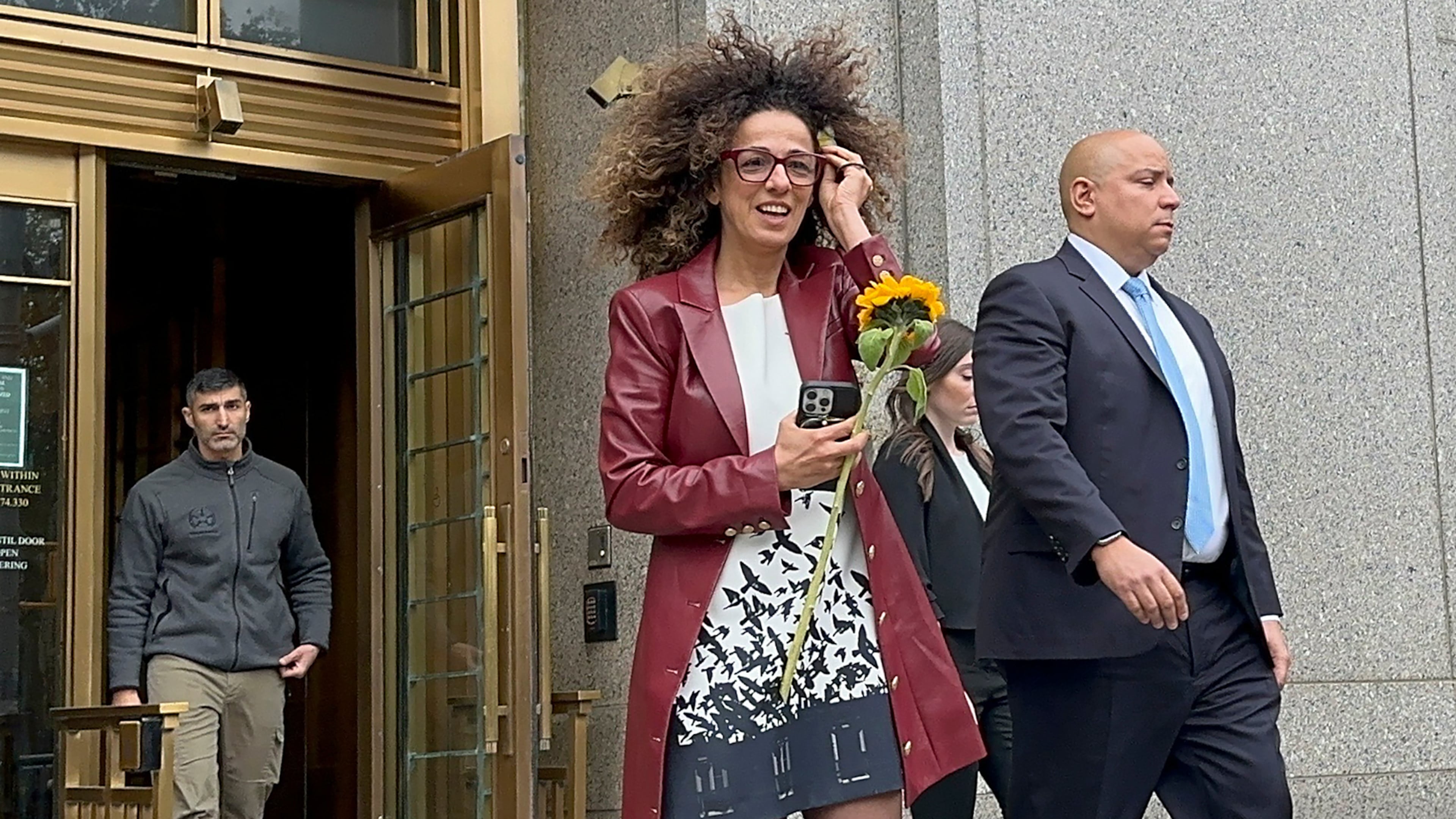 Iranian American journalist Masih Alinejad walks out of Manhattan federal court, Wednesday, Oct. 29, 2025, in New York, after two Russian mobsters were sentenced to 25 years in prison for agreeing to attempt to assassinate her. (AP Photo/Larry Neumeister)