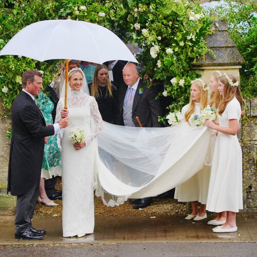 Bride Harriet Sperling and bride groom Peter Phillips, accompanied by bridesmaids after their wedding ceremony at All Saints Church in Kemble, Gloucestershire, England, Saturday, June 6, 2026. (Ben Birchall/PA via AP)