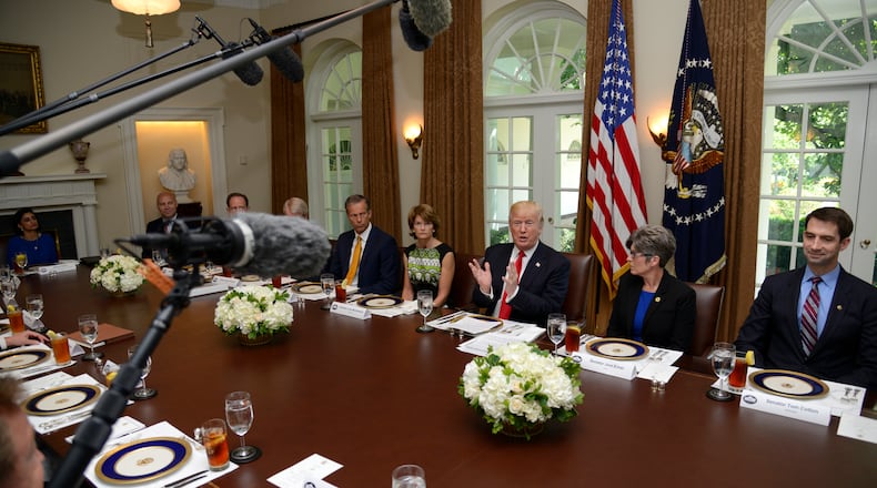 President Donald Trump hosts a working lunch with Republican members of the U.S. Senate in the White House on Tuesday. Trump and lawmakers discussed administration plans to repeal and replace the Affordable Care Act, also known as Obamacare. Mike Theiler-Pool/Getty Images