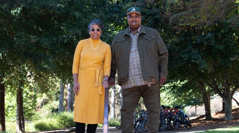 Hattie Whitehead and Bobby Crook stand on a pathway in the area of the University of Georgia campus that was once the Linnentown neighborhood on Monday, Oct 18, 2021. 
(Sarah White for the Atlanta Journal-Constitution)