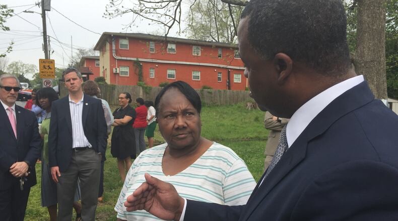 Atlanta Mayor Kasim Reed on Wednesday talks to English Avenue resident Thelma Benton, 72, about a new fund designed to help residents in the community stay in their homes as gentrification lurks.