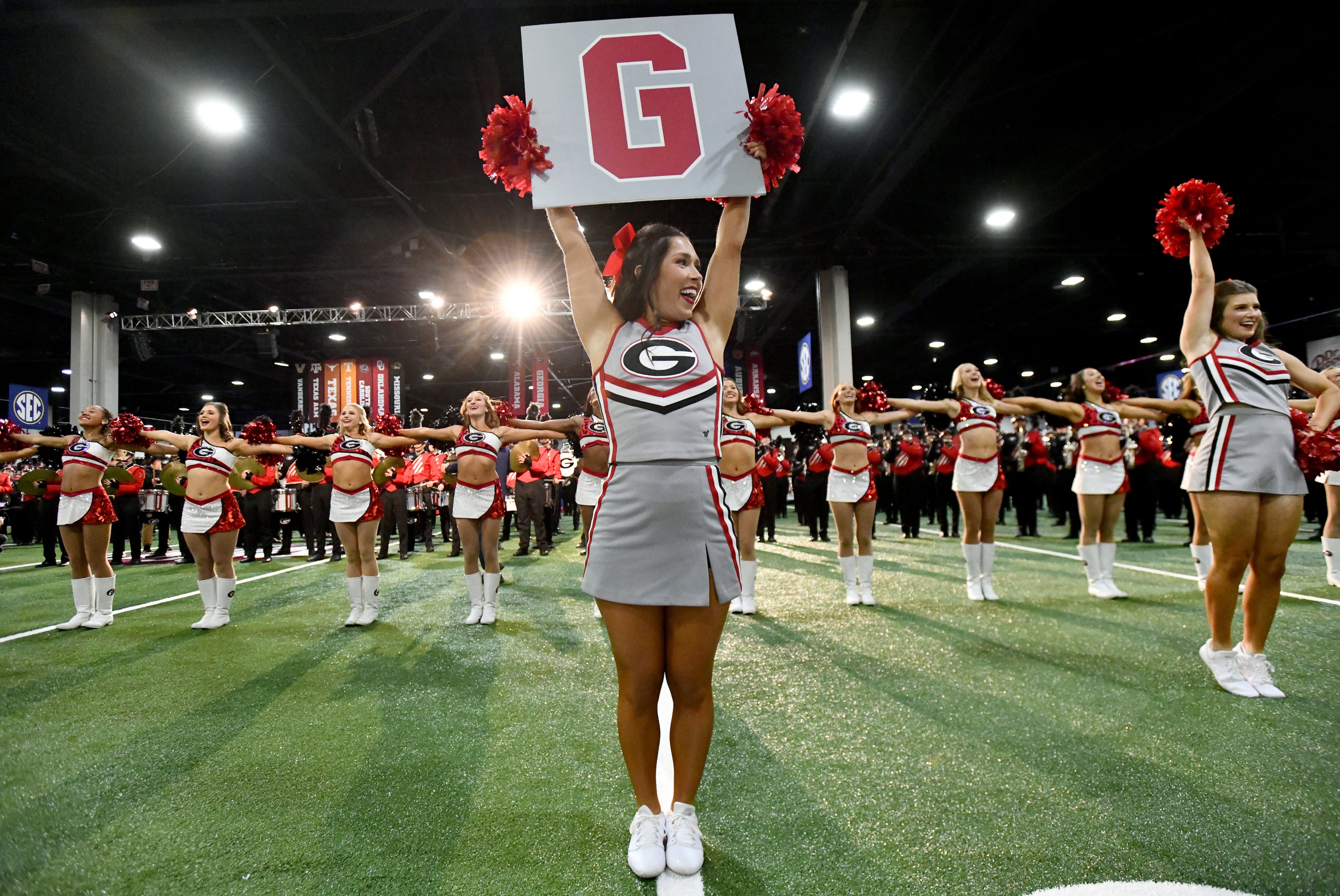 Members of Georgia’s Spirit Squad entertain fans during pep rallies at The Dr Pepper SEC FanFare ahead of the SEC Championship football game between Georgia and Alabama, Saturday, Dec. 6, 2025 in Atlanta. (Hyosub Shin/AJC)