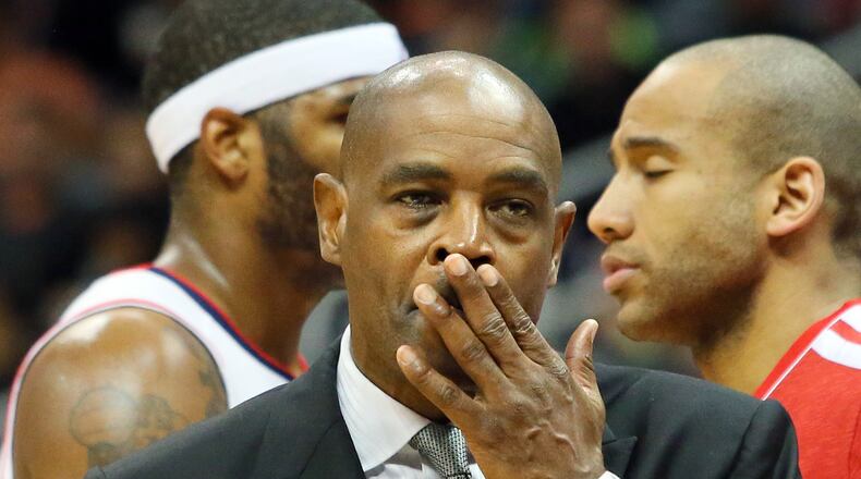 Hawks head coach Larry Drew calls a time out in the final minutes of the game Friday, May 3, 2013, in Atlanta.