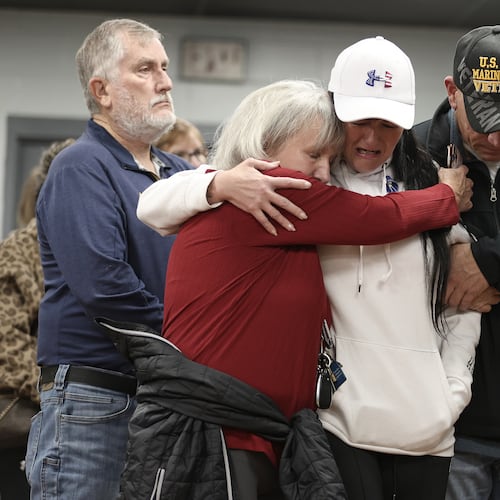 People gather for a vigil in honor of National Guard member Specialist Sarah Beckstrom, one of two National Guard members who were shot in Washington on Wednesday, in Webster Springs, W.Va., Friday, Nov. 28, 2025. (AP Photo/Kathleen Batten)
