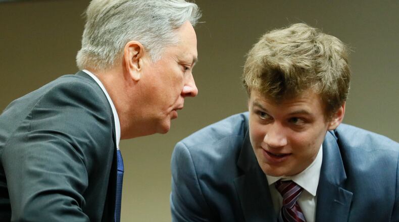 September 27, 2019 - Decatur - Robert Olsen confers with Lukas Alfen, one of his attorneys, between witnesses this morning. The murder trial of former DeKalb County Police Officer Robert "Chip" Olsen continued with testimony from prosecution witnesses this morning. Olsen is charged with murdering war veteran Anthony Hill. Bob Andres / robert.andres@ajc.com