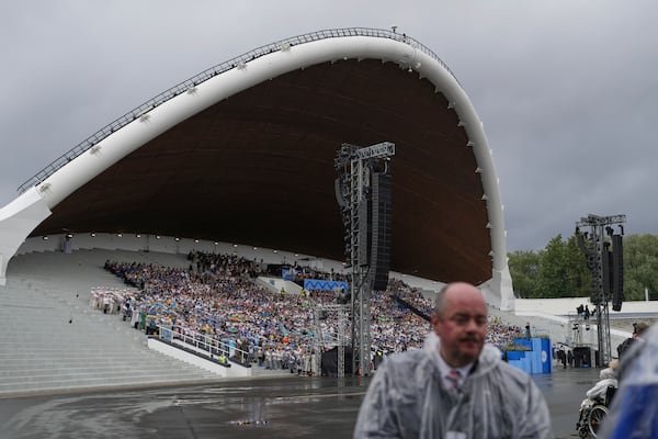 Choir singers attend the "Iseoma" Song and Dance Celebration at the Song Festival Grounds in Tallinn, Estonia, on Sunday, July 6, 2025. (AP Photo/Sergei Grits)