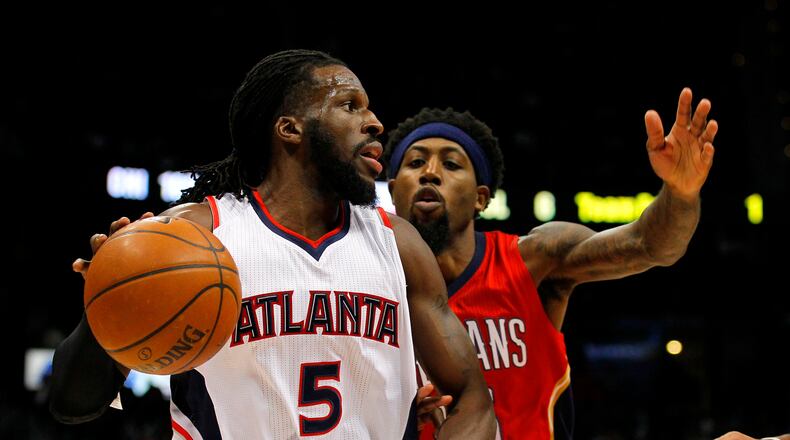Atlanta Hawks forward DeMarre Carroll (5) drives against New Orleans Pelicans forward John Salmons (15) in the first period of an NBA basketball game in Atlanta, Friday, Nov. 28, 2014. The Hawks won 100-91. (AP Photo/Todd Kirkland)