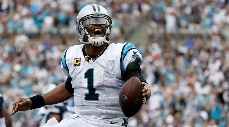 Panthers quarterback Cam Newton celebrates a touchdown against the Dallas Cowboys Sept. 9, 2018, at Bank of America Stadium in Charlotte, N.C.