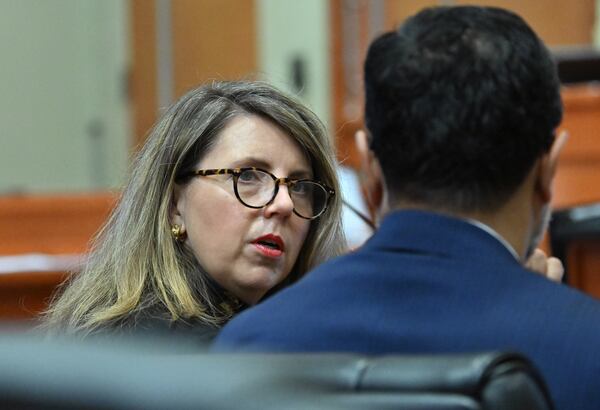 Lynsey Barron (left) and Manny Arora, attorneys for Sumanth and Anindita Rao confer, during a hearing before Superior Court Judge Tangela Barrie at DeKalb County Courthouse in April 2026. (Hyosub Shin/AJC)