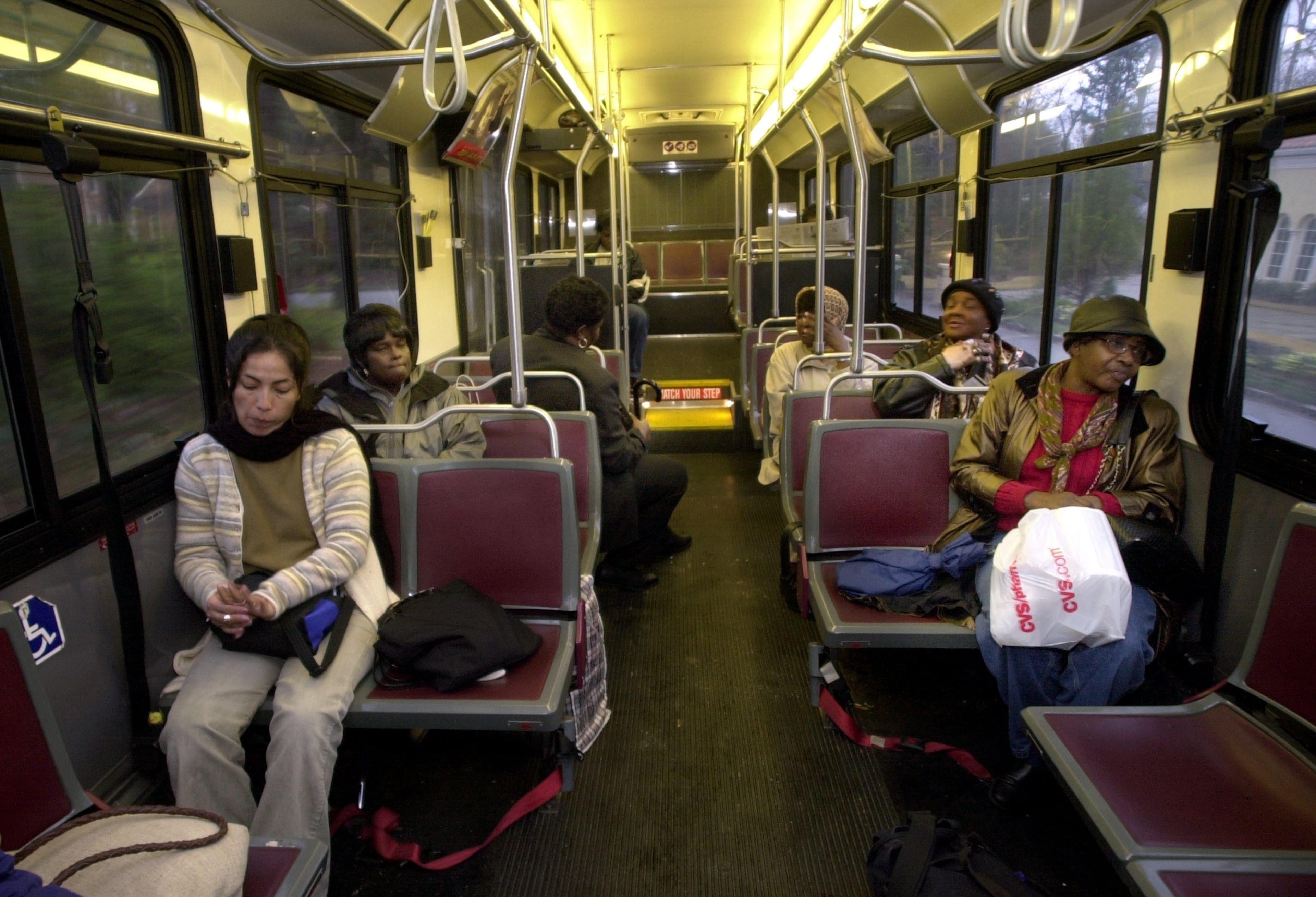 Atlanta maids leaving work ride MARTA bus route 706 from the Mt. Paran Rd. area to downtown Atlanta in December 2001. (Charlotte B. Teagle/AJC file photo)