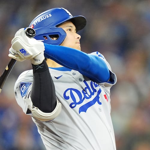 Los Angeles Dodgers' Shohei Ohtani hits a two-run home run against the Toronto Blue Jays during the seventh inning of Game 1 of baseball's World Series in Toronto, Friday, Oct. 24, 2025. (Frank Gunn/The Canadian Press via AP)