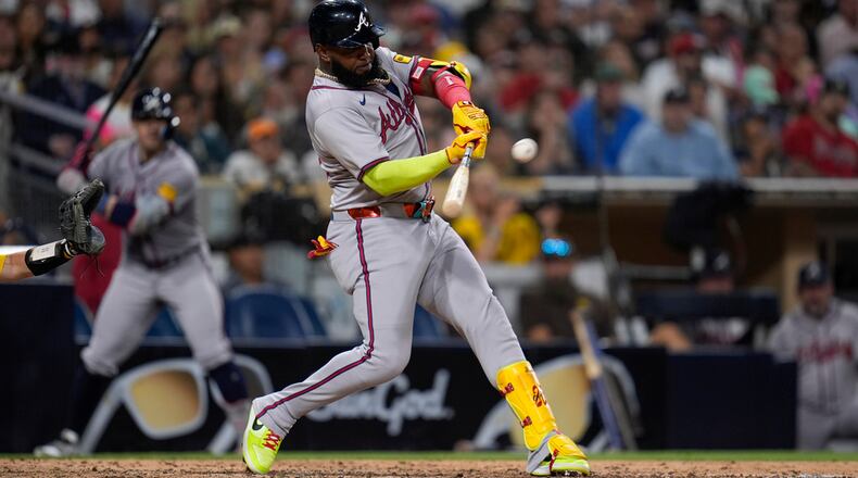 Atlanta Braves' Marcell Ozuna hits a home run during the ninth inning of a baseball game against the San Diego Padres, Friday, July 12, 2024, in San Diego. (AP Photo/Gregory Bull)