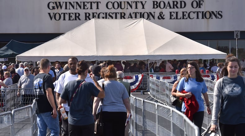 Early voters wait outside Gwinnett County Board of Voter Registration and Elections in Lawrenceville on Wednesday, Oct. 26, 2016. HYOSUB SHIN / HSHIN@AJC.COM