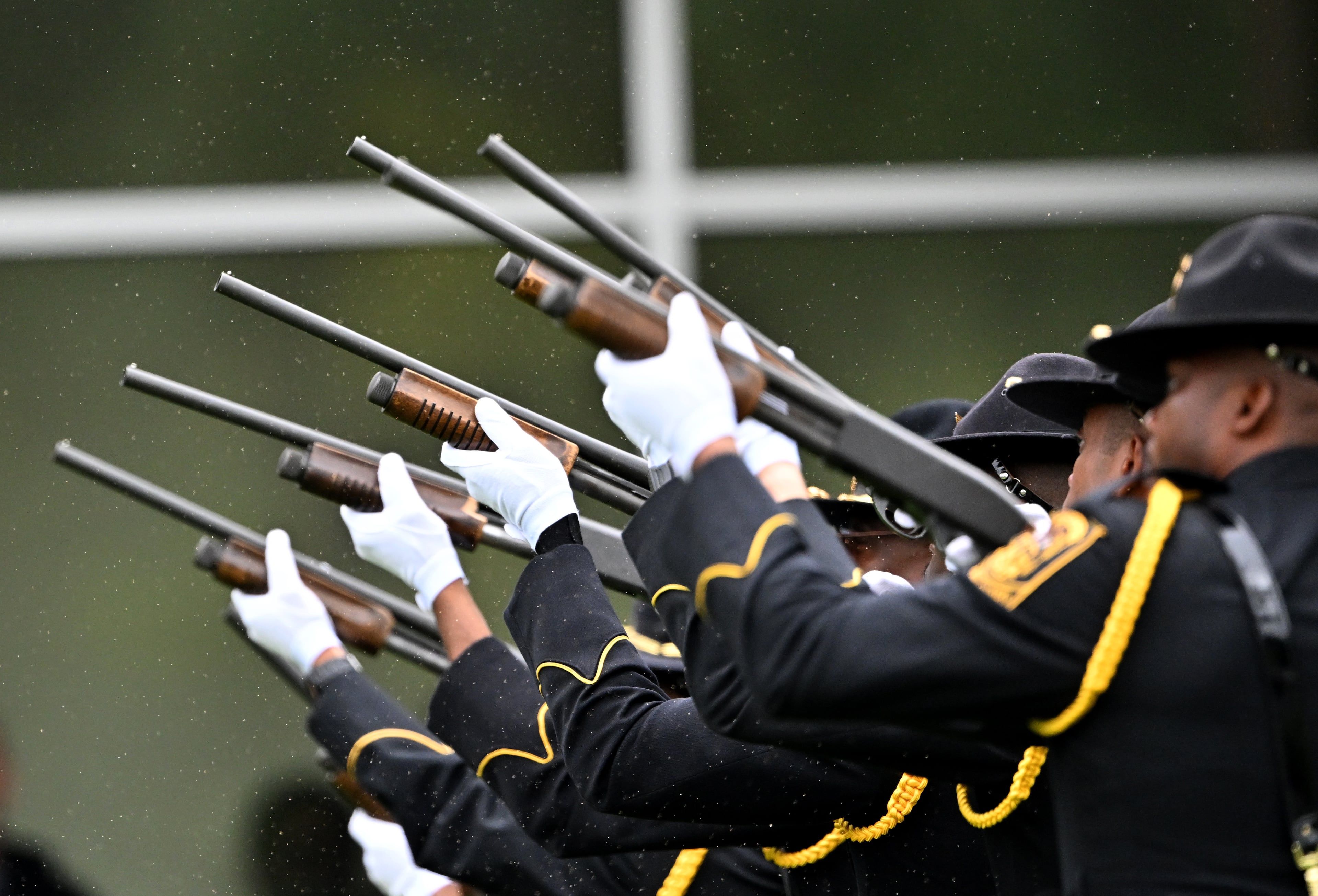 A gun salute is seen during the Final Honors following the memorial service for DeKalb County police Officer David Rose, who was killed while responding to the Aug. 8 shooting at the CDC, outside the First Baptist Church Atlanta, Friday, August 22, 2025, in Atlanta. Hyosub Shin / AJC)