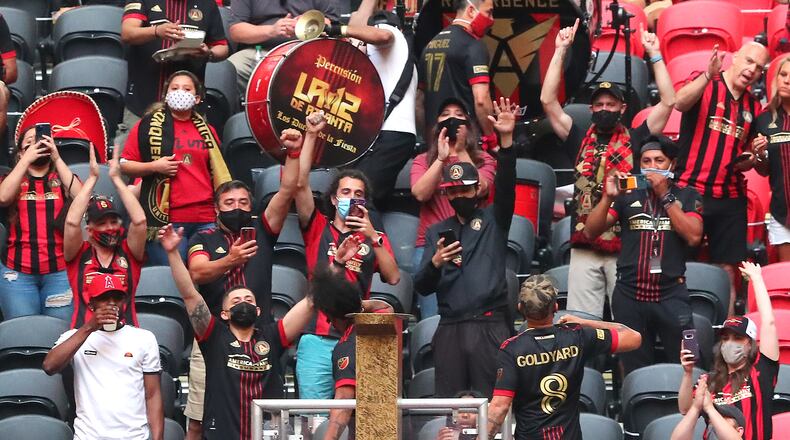 Atlanta United fans cheer on The Five Stripes as they prepare to play Philadelphia Union in the first leg of the CONCACAF Champions League quarterfinals Tuesday, April 27, 2021, at Mercedes-Benz Stadium in Atlanta. (Curtis Compton / Curtis.Compton@ajc.com)