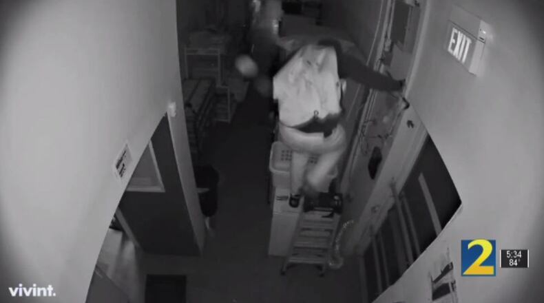 Surveillance footage from the Petland in Dunwoody shows a burglar with a crowbar scrambling to escape Thursday morning following a confrontation with the store’s owner, who was armed with a shotgun.