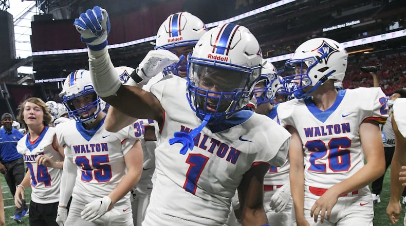August 21, 2021 Atlanta - Walton's Sutton Smith (1) celebrates for his game-winning touchdown in overtime during the 2021 Corky Kell Classic on Saturday, August 21, 2021. Walton won 34-28 over Lowndes in overtime. (Hyosub Shin / Hyosub.Shin@ajc.com)