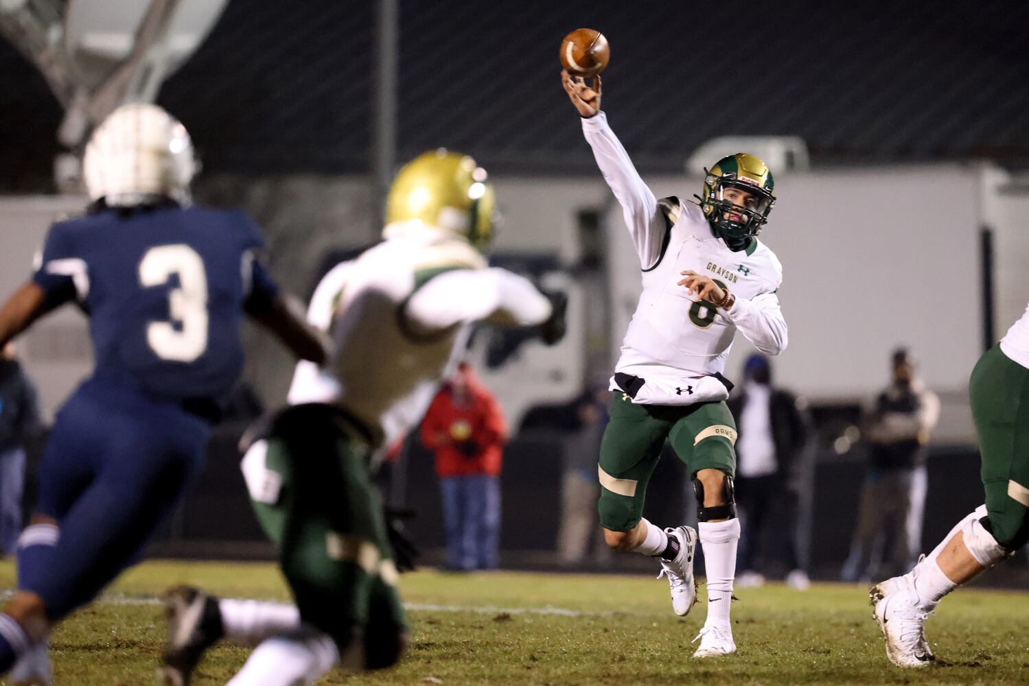 Dec. 18, 2020 - Norcross, Ga: Grayson quarterback Jake Garcia (8) throws a touchdown pass to wide receiver Jamal Haynes, left, in the first half against Norcross in the Class AAAAAAA semi-final game at Norcross high school Friday, December 18, 2020 in Suwanee, Ga.. JASON GETZ FOR THE ATLANTA JOURNAL-CONSTITUTION