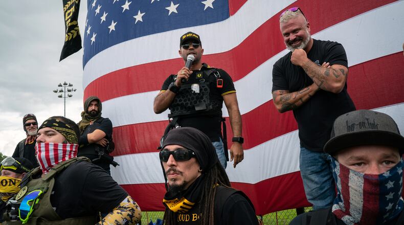 FILE — Enrique Tarrio, then-leader of the Proud Boys, speaks at a rally in Portland, Ore., on Sept. 26, 2020. Tarrio has been charged with conspiring with other top lieutenants of the far-right nationalist group to attack the Capitol last year, according to an indictment set to be released on Tuesday, March 8, 2022, by federal prosecutors. (Diana Zeyneb Alhindawi/The New York Times)