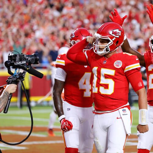 Kansas City Chiefs quarterback Patrick Mahomes (15) celebrates his touchdown run with teammates wide receiver Rashee Rice (4), wide receiver Tyquan Thornton (2) and guard Trey Smith (65) during the first half of an NFL football game against the Denver Broncos, Monday, Sept. 14, 2026, in Kansas City, Mo. (AP Photo/Colin E. Braley)