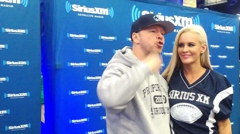 Donnie Wahlberg gets hyped with wife Jenny McCarthy. Photo: Melissa Ruggieri/AJC