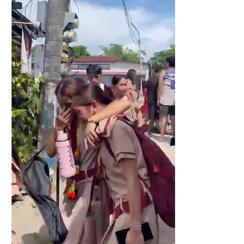 In this photo taken from a video, students react after a shooting incident at the San Jose National High School in Tacloban city, Philippines Monday, June 22, 2026. (James Daantos via AP Photo)