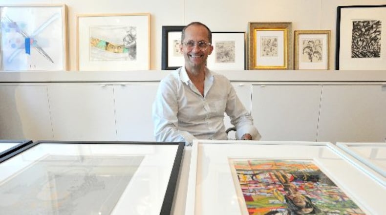High Museum curator of modern and contemporary art Michael Rooks with works from "Drawing Inside the Perimeter," a major 2013 exhibit that featured pieces by more than 40 metro artists. HYOSUB SHIN / HSHIN@AJC.COM