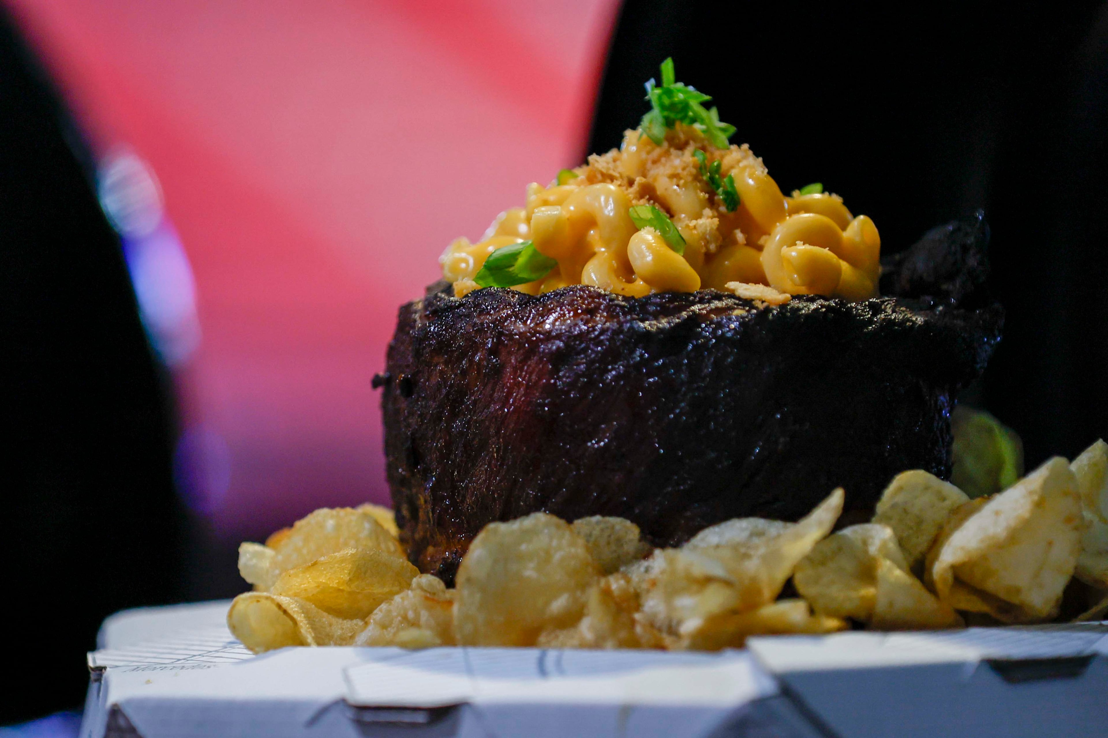 The Stadium Rack-O-Ribs, which will be available for a limited time at several concessions around the stadium, is served with macaroni and cheese, Ritz cracker crumbs, green onions and kettle chips. (Miguel Martinez/AJC)