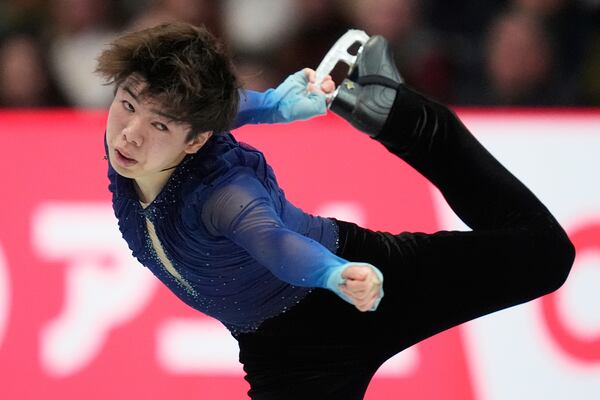 Shun Sato, of Japan, performs during the men's free skating program at the figure skating world championships, Saturday, March 29, 2025, in Boston. (AP Photo/Charles Krupa)