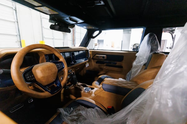 The leather interior of a Vintage Modern vehicle, which also features air bags and current technology, was shown during a tour of the company's Buford headquarters on June 26, 2026. (Estela Muñoz/AJC)
