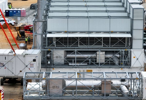 An aerial view shows off-grid generators being installed by a company called VoltaGrid on land next door to a data center on Thursday, June 25, 2026, in Covington. (Hyosub Shin/AJC)