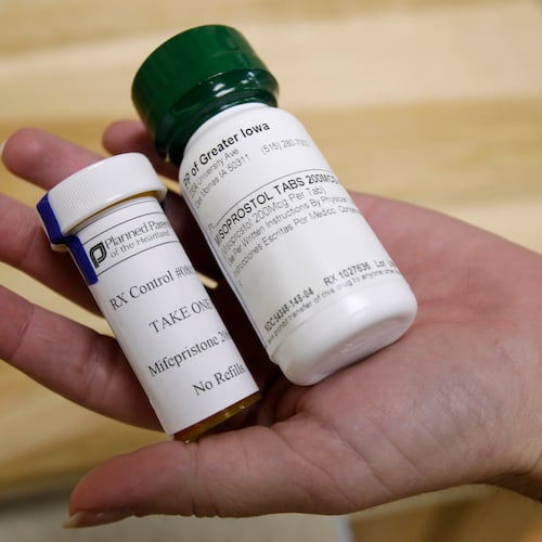 FILE - Bottles of abortion pills mifepristone, left, and misoprostol, right, are displayed at a clinic in Des Moines, Iowa, Sept. 22, 2010. (AP Photo/Charlie Neibergall, File)