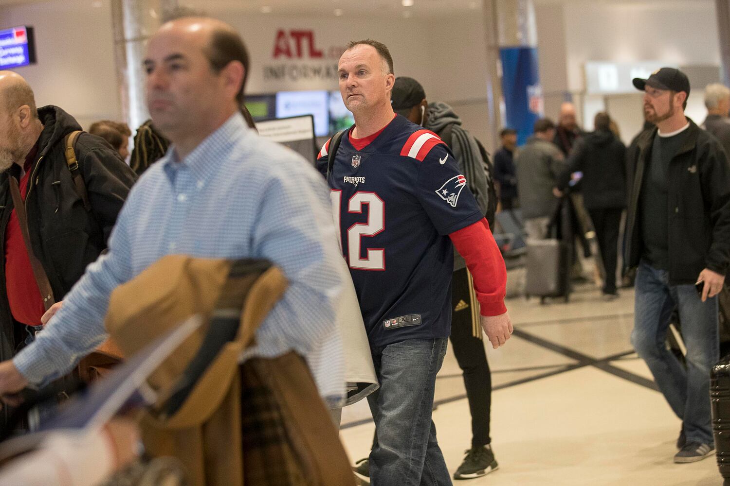 PHOTOS: Fans flock into Atlanta airport for Super bowl