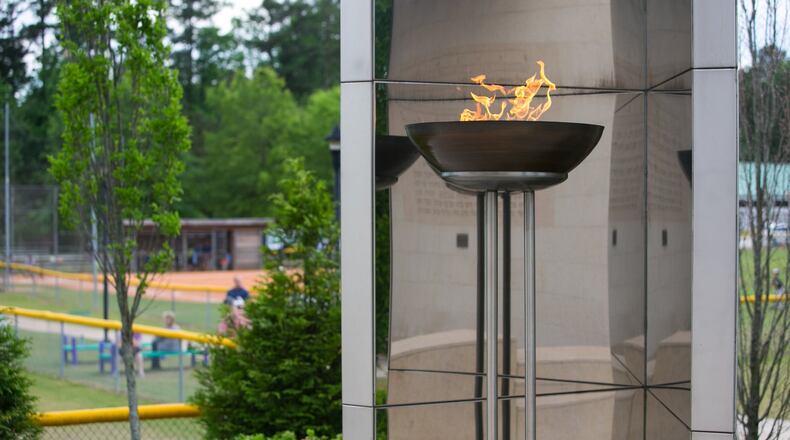 The eternal flame is shown in the Besser Holocaust Memorial Garden overlooking the baseball fields at the Marcus Jewish Community Center Tuesday, May 12, 2015, in Dunwoody. AJC FILE PHOTO