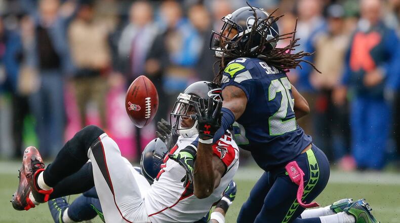 Wide receiver Julio Jones of the Atlanta Falcons can’t make the catch on fourth down as cornerback Richard Sherman of the Seattle Seahawks defends at CenturyLink Field on Oct. 16, 2016 in Seattle, Washington. (Photo by Otto Greule Jr/Getty Images)
