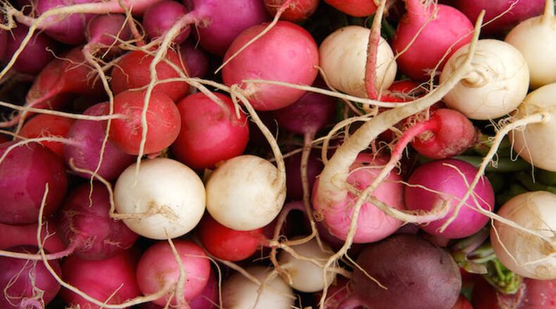 Fresh radishes on sale at local farmers market. (Dreamstime/TNS)