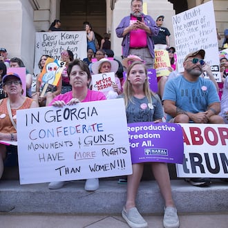 Abortion rights supporters gather on the steps of the state Capitol during a rally in May 2019. (Alyssa Pointer/AJC)