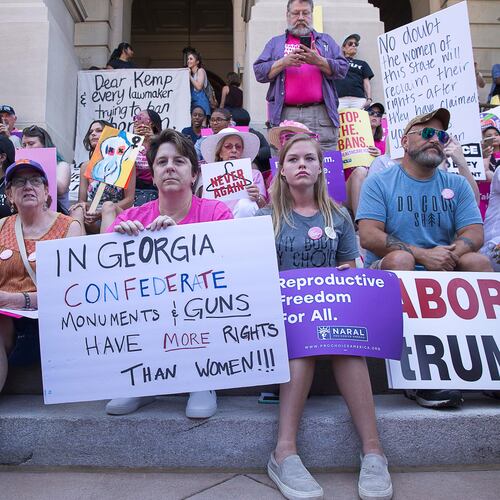 Abortion rights supporters gather on the steps of the state Capitol during a rally in May 2019. (Alyssa Pointer/AJC)