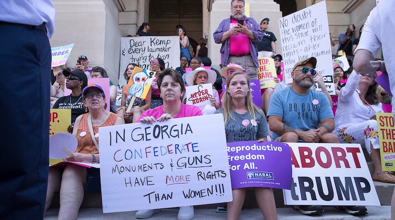 Abortion rights supporters gather on the steps of the state Capitol during a rally in May 2019. (Alyssa Pointer/AJC)