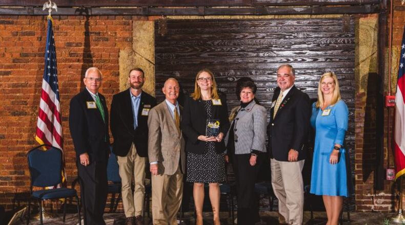 Among those at the Golden Radish Awards ceremony were (l-r) Georgia Commissioner of Agriculture Gary W. Black; Joseph Reynolds of Georgia Organics; Dr. J. Patrick O’Neal, Commissioner, Georgia Department of Public Health; Emily Halin, executive director of the Cobb County School District Food and Nutrition Services Department; Dr. Laura Perry Johnson, Associate Dean for UGA Extension; Georgia School Superintendent Richard Woods and Amy Jacobs, Commissioner, Georgia Department of Early Care and Learning. Courtesy of Cobb County School District