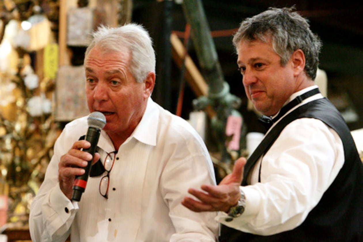 Atlanta art and antiques appraiser and auctioneer Allan Baitcher (right) takes bids during a 2020 auction. Baitcher and his company, Peachtree Antiques, are being sued by a Florida multimillionaire who says he paid them $20 million for fakes. (AJC 2020)