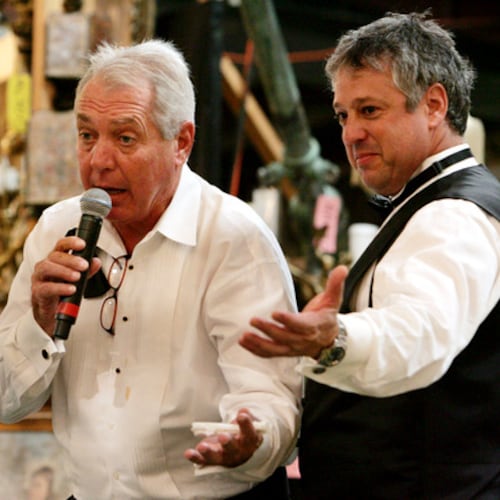 Atlanta art and antiques appraiser and auctioneer Allan Baitcher (right) takes bids during a 2020 auction. Baitcher and his company, Peachtree Antiques, are being sued by a Florida multimillionaire who says he paid them $20 million for fakes. (AJC 2020)