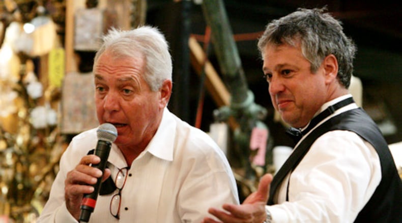 Atlanta art and antiques appraiser and auctioneer Allan Baitcher (right) takes bids during a 2020 auction. Baitcher and his company, Peachtree Antiques, are being sued by a Florida multimillionaire who says he paid them $20 million for fakes. (AJC 2020)