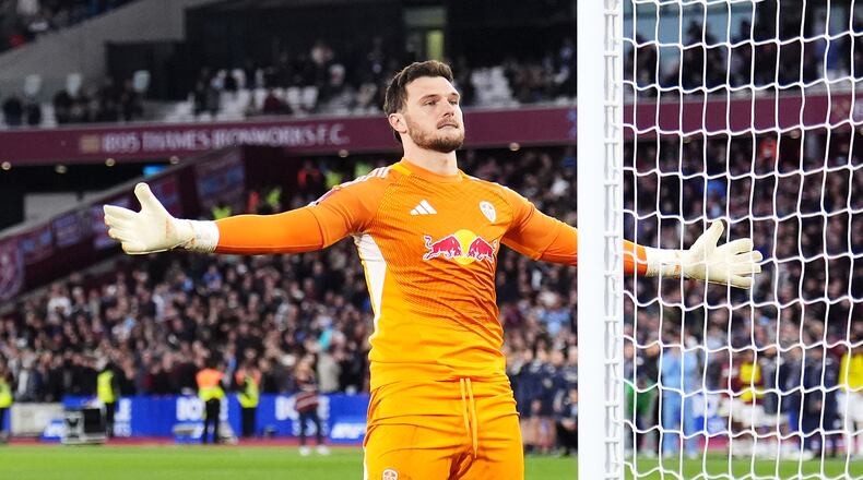 Leeds United goalkeeper Lucas Perri celebrates saving West Ham United's Jarrod Bowen penalty in the shoot-out during the English FA Cup quarterfinal soccer match between West Ham United and Leeds United, in London, Sunday April 5, 2026. (John Walton/PA via AP)