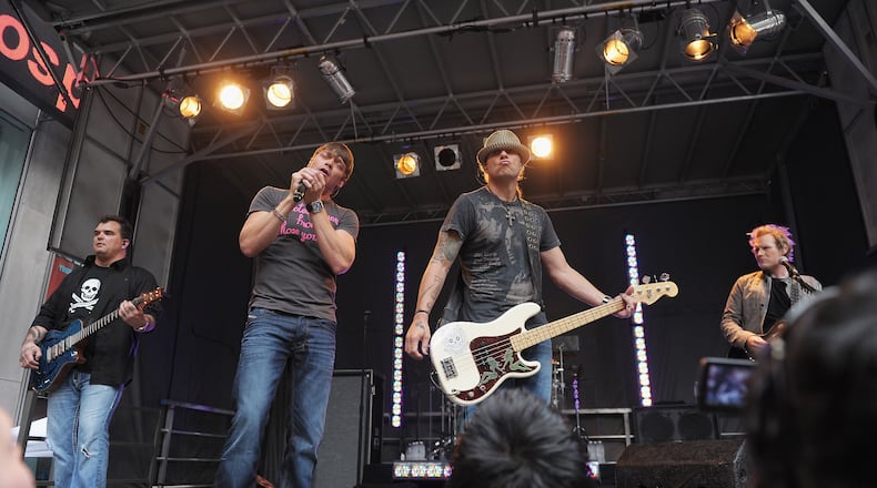 NEW YORK, NY - JULY 29: (L-R) Guitarist Chris Henderson, vocalist Brad Arnold, bassist Greg Upchurch and guitarist Matt Roberts of Three Doors Down perform on "FOX and Friends" outside of FOX Studios on July 29, 2011 in New York City. (Photo by Michael Loccisano/Getty Images)