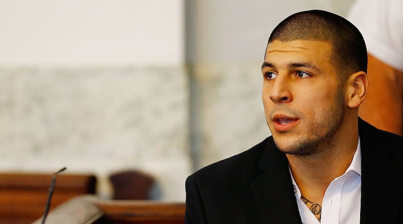 NORTH ATTLEBORO, MA - AUGUST 22: Aaron Hernandez sits in the courtroom of the Attleboro District Court during his hearing on August 22, 2013 in North Attleboro, Massachusetts. Former New England Patriot Aaron Hernandez has been indicted on a first-degree murder charge for the death of Odin Lloyd. (Photo by Jared Wickerham/Getty Images)