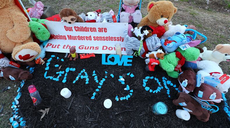 A memorial for 6-month-old Grayson Matthew Fleming-Gray is seen outside the Food Mart where he was shot and killed in 2022.