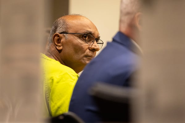 Mahendra Patel (left) sits for his bond hearing in a Cobb County courtroom in Marietta on Tuesday, May 6, 2025. (Arvin Temkar/AJC)
